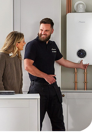 Installer beside a boiler